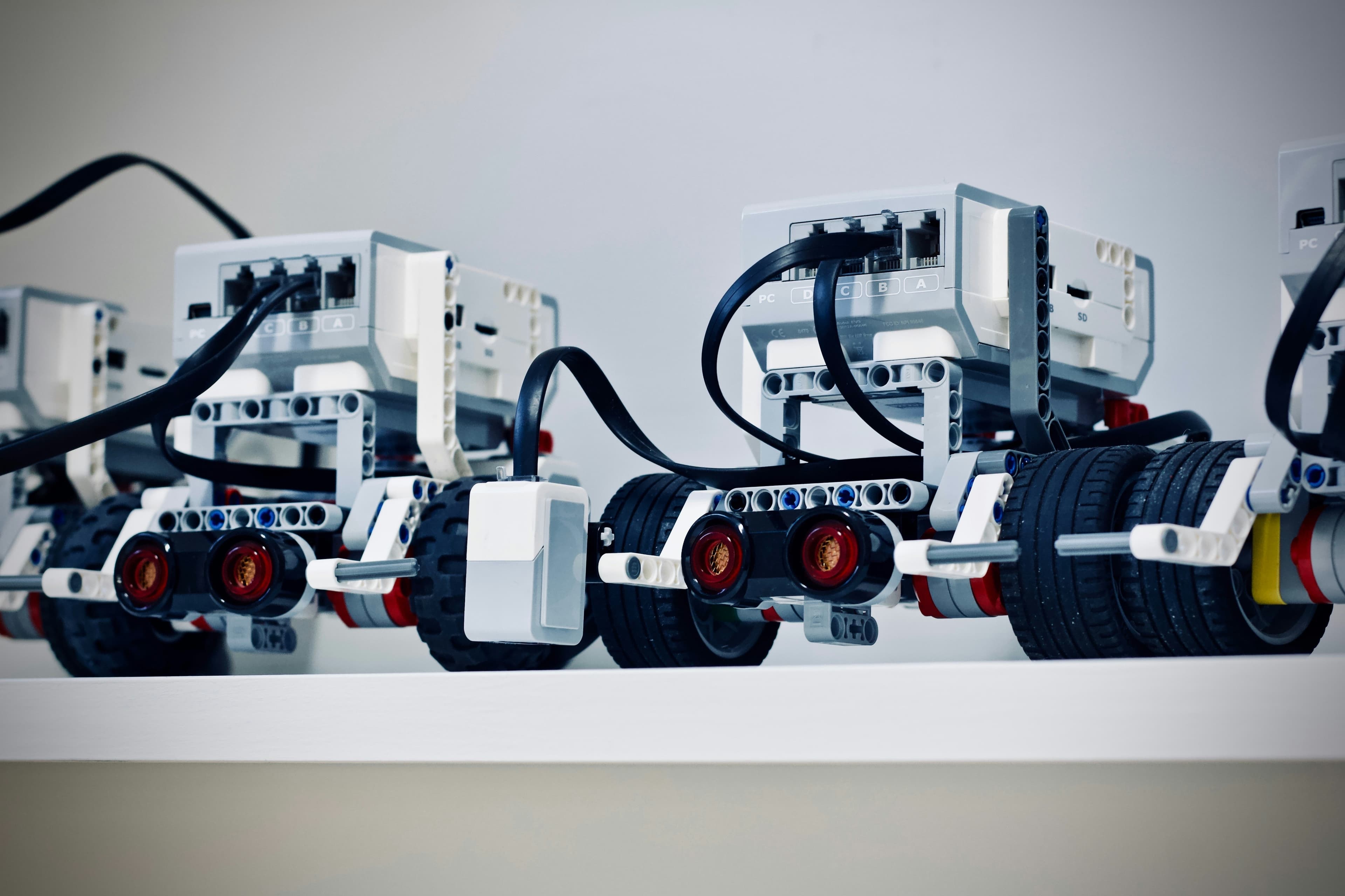 Two LEGO Mindstorms robots on a white table