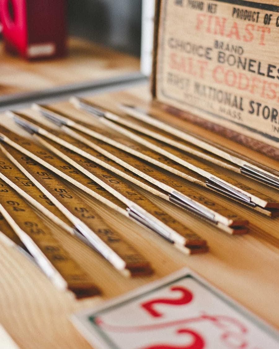 Rulers and pencils on a school supply shelf